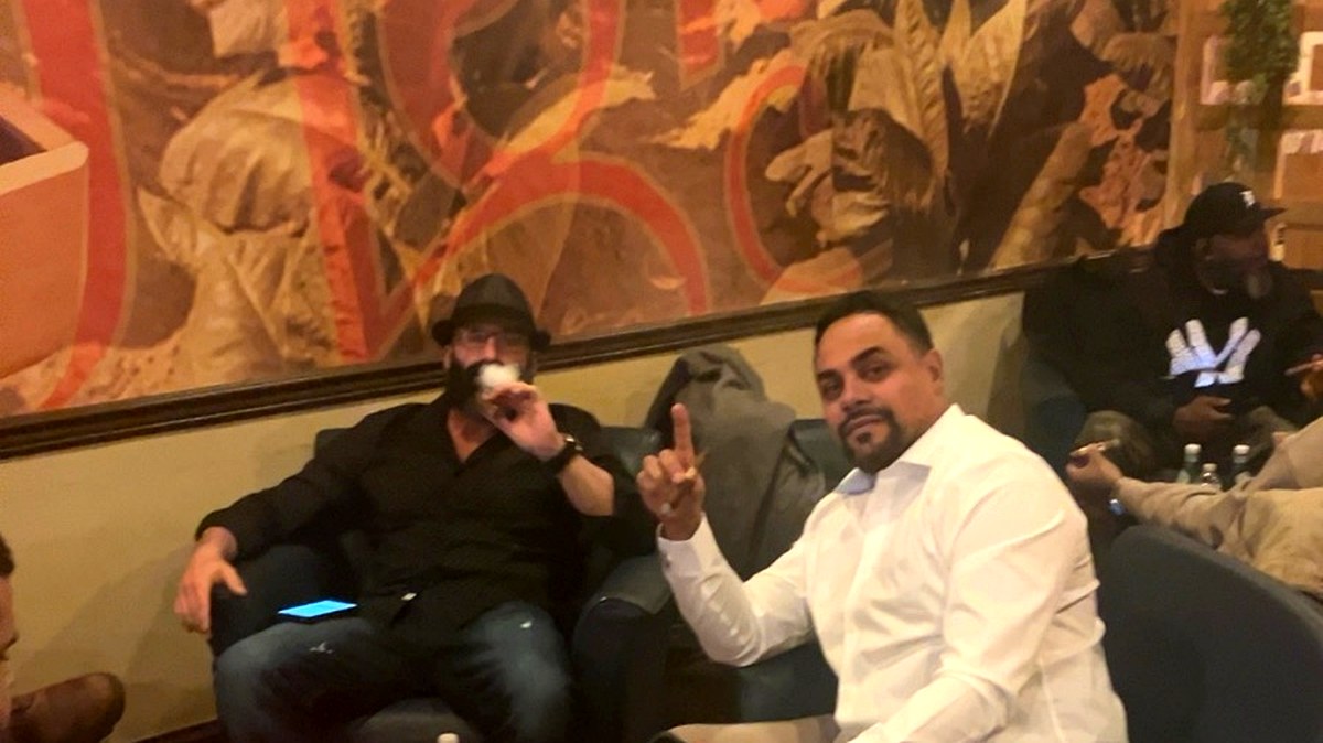 Guests enjoying cigars and bourbon in the Casa Del Tabaco lounge